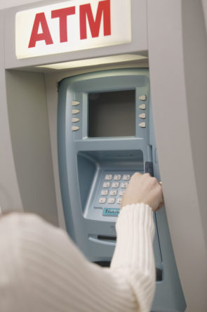 Woman Using Atm Machine