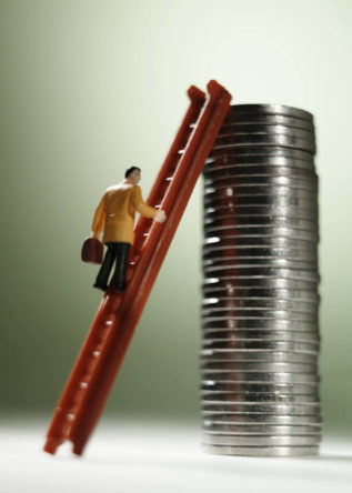 businessman climbing ladder against stack of coins